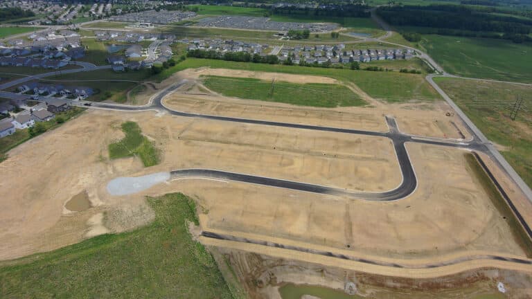 Lebanon, IN, aerial view of a subdivision under development with surrounding neighborhoods and newly graded lots.